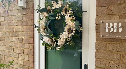 Elegant wreath on the door of Brows & Beauty by Georgia, Effingham, England, GB.