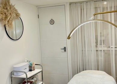 Tranquil treatment room at Brows & Beauty by Georgia, Effingham, England, GB, featuring elegant decor.
