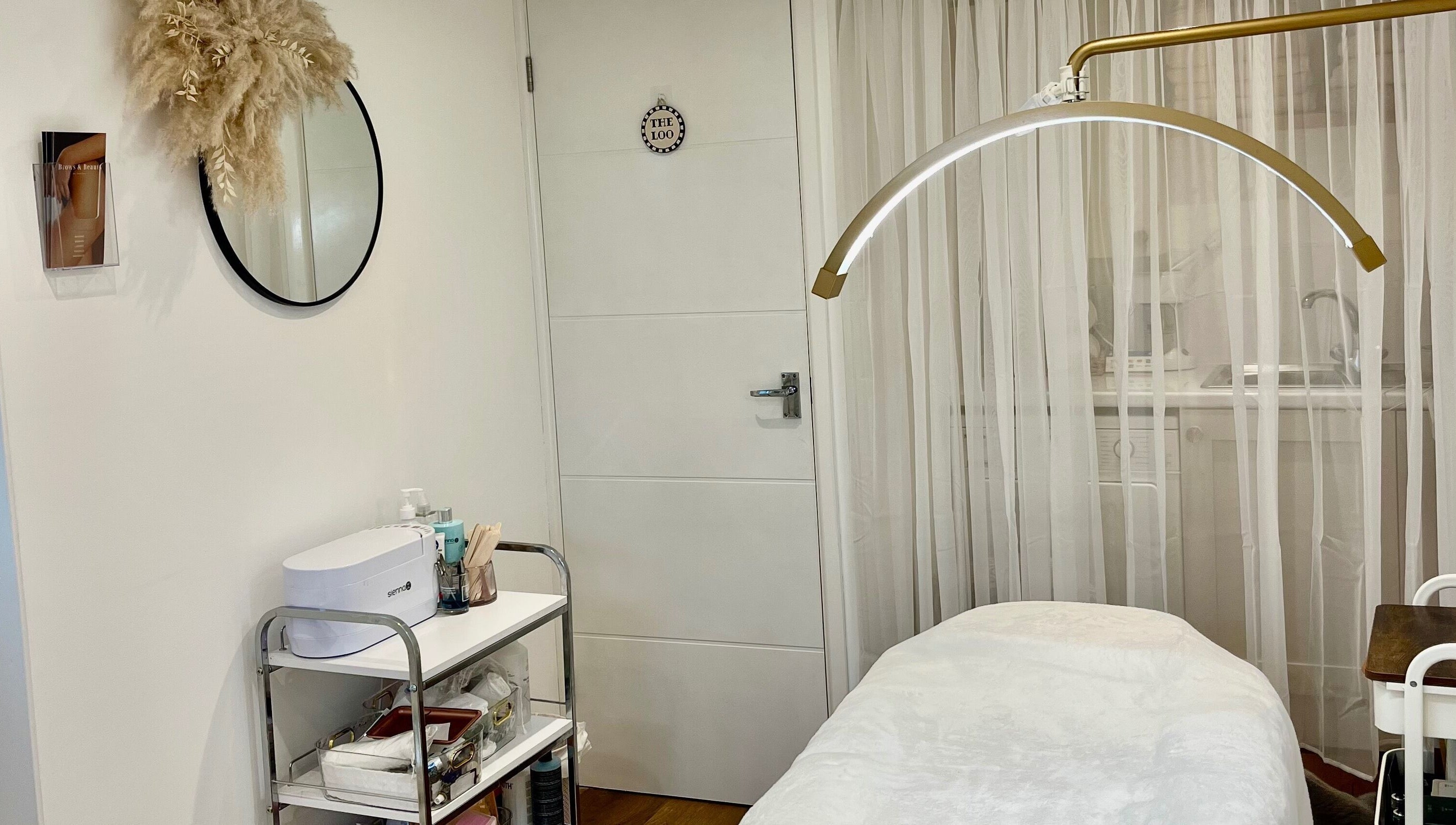 Tranquil treatment room at Brows & Beauty by Georgia in Effingham, England, GB, featuring a massage table.