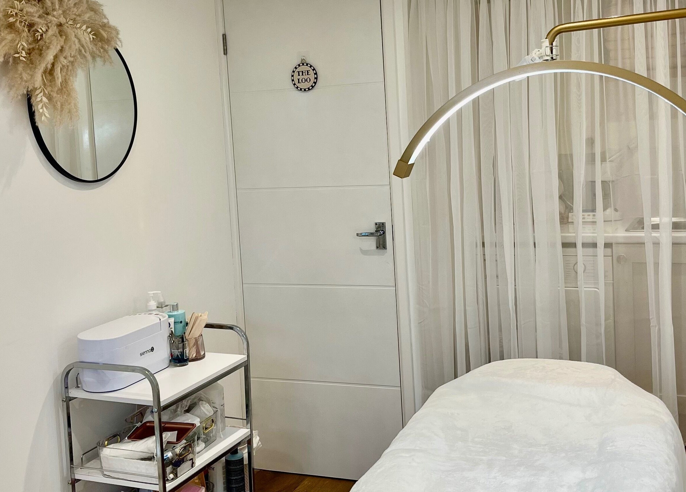 Tranquil treatment room at Brows & Beauty by Georgia in Effingham, England, GB, featuring a massage table.