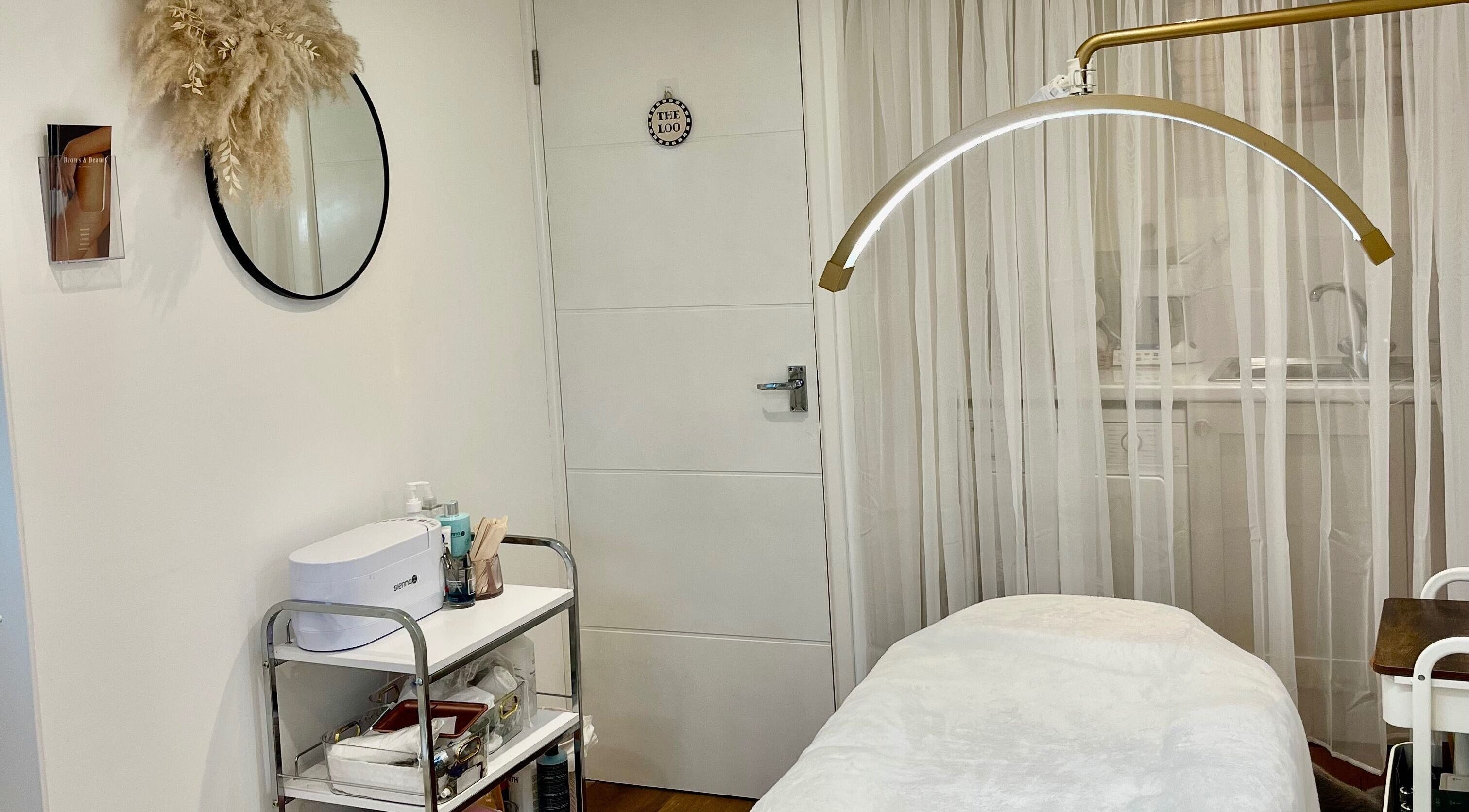 Tranquil treatment room at Brows & Beauty by Georgia in Effingham, England, GB, featuring a massage table.