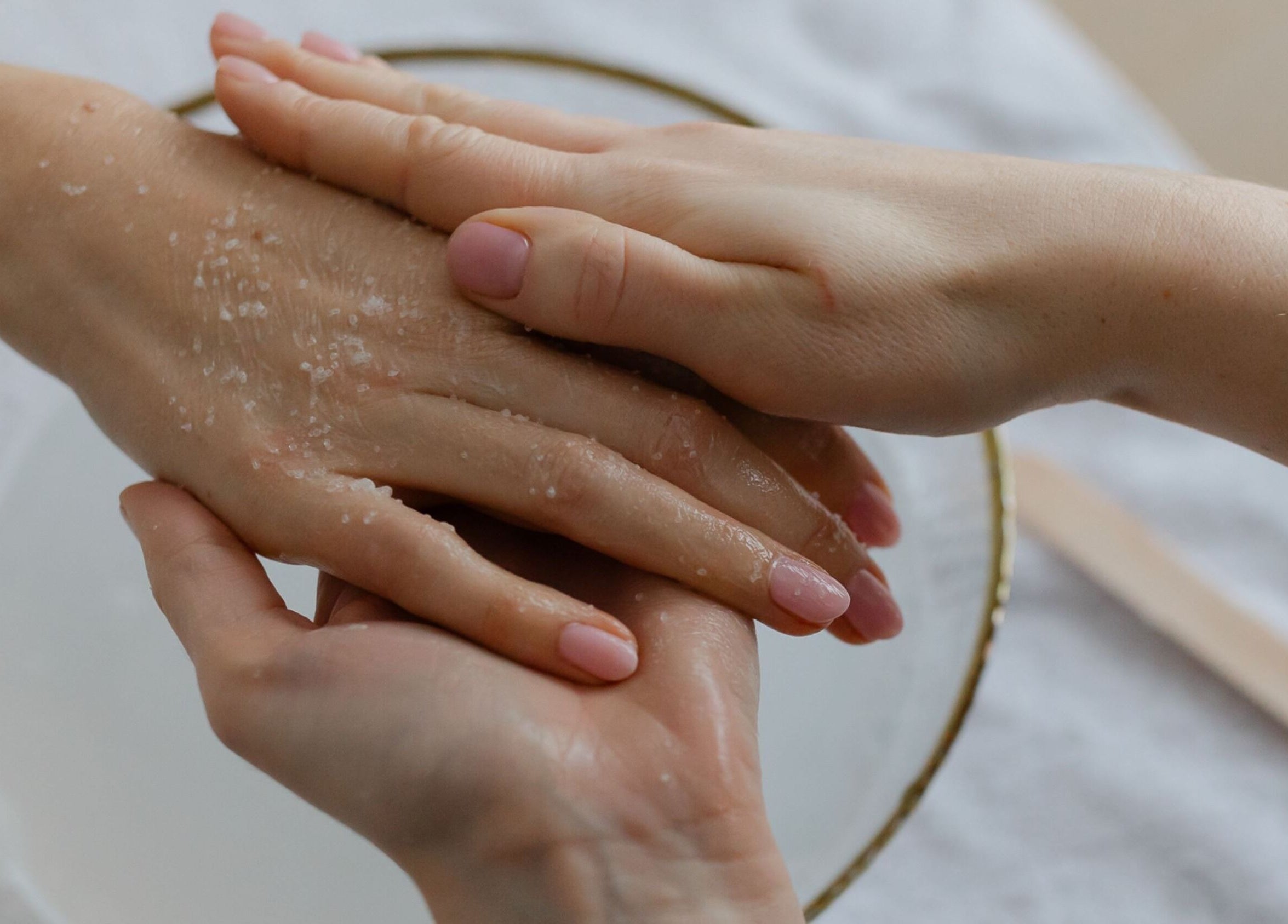 Hand exfoliation treatment at Click Nails, Cheltenham, England, GB. Pampered hands with gentle care.