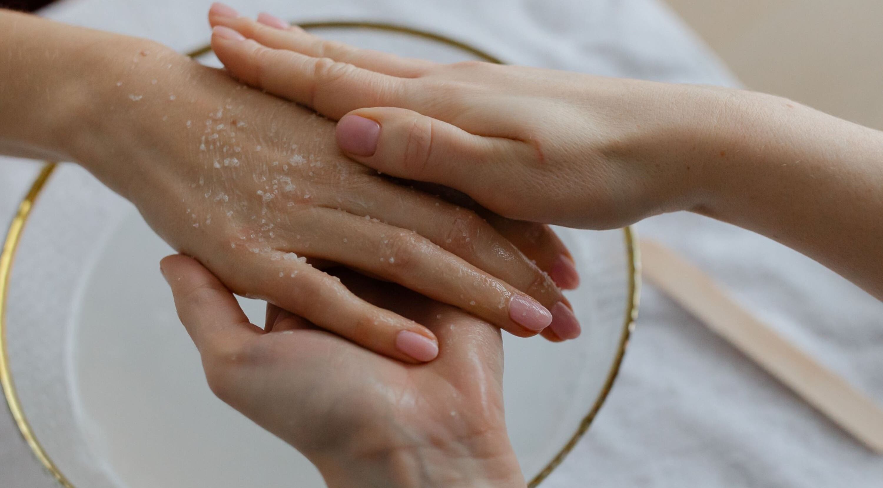 Hand exfoliation treatment at Click Nails, Cheltenham, England, GB. Pampered hands with gentle care.
