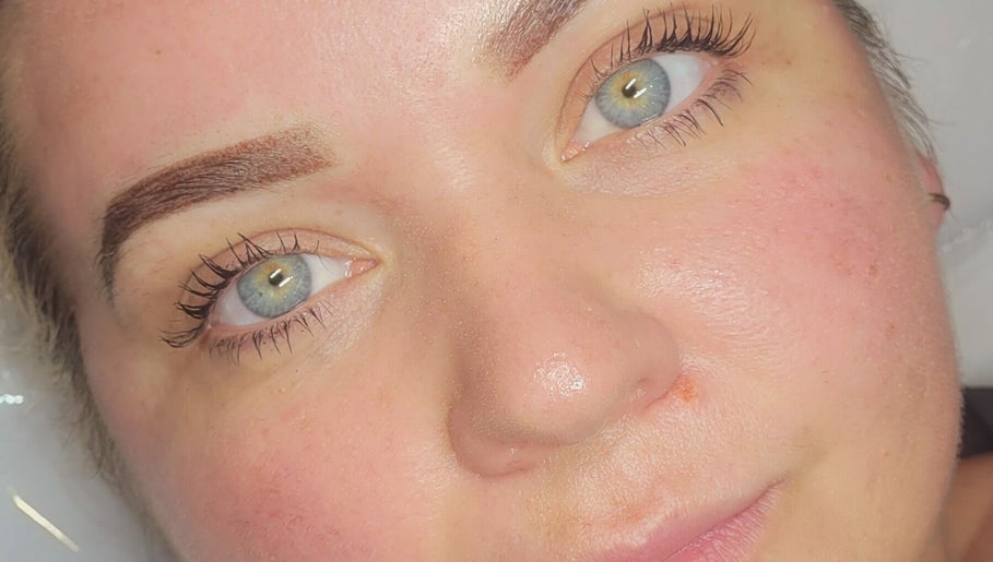 Close-up of radiant eyes post-treatment at Cupids Glow, Bolton, England, GB, showcasing flawless brows.