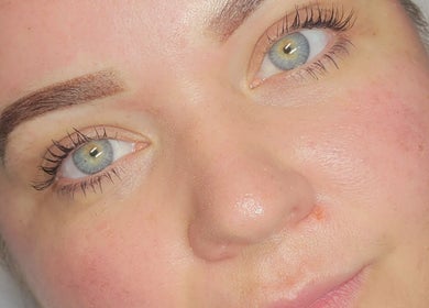 Close-up of radiant eyes post-treatment at Cupids Glow, Bolton, England, GB, showcasing flawless brows.