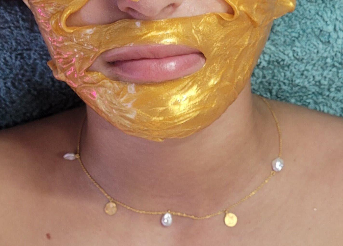 Luxurious gold face mask treatment at Cupids Glow in Bolton, England, GB for radiant, revitalized skin.