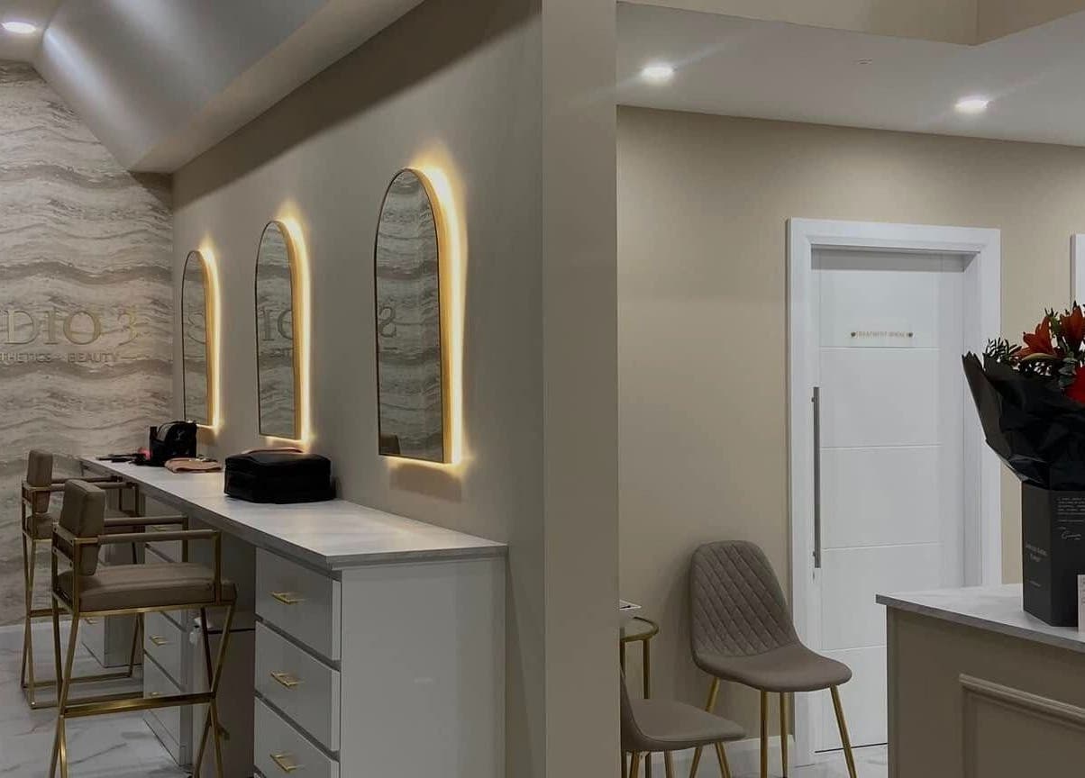 Elegant interior of Studio 3, Swatragh, Northern Ireland, GB with stylish mirrors and chic seating area.