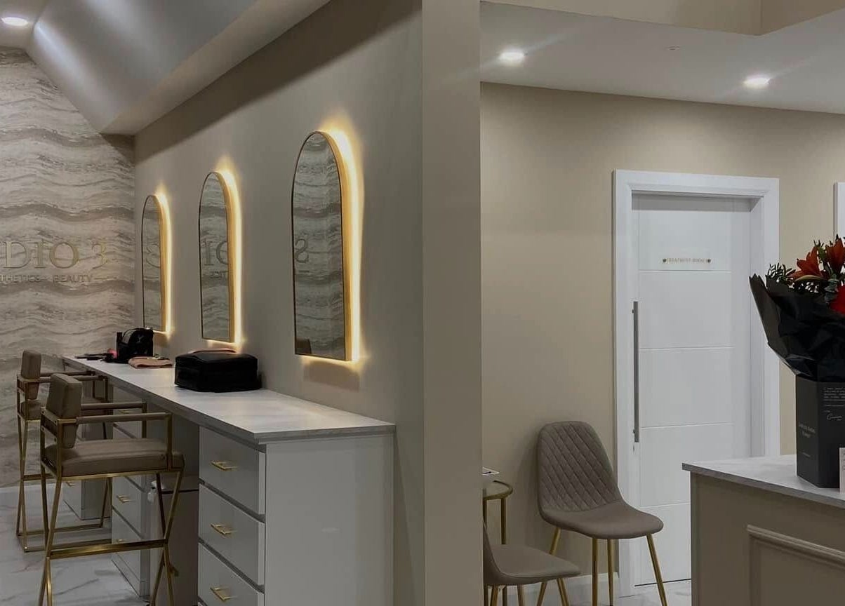 Elegant interior of Studio 3, Swatragh, Northern Ireland, GB with stylish mirrors and chic seating area.