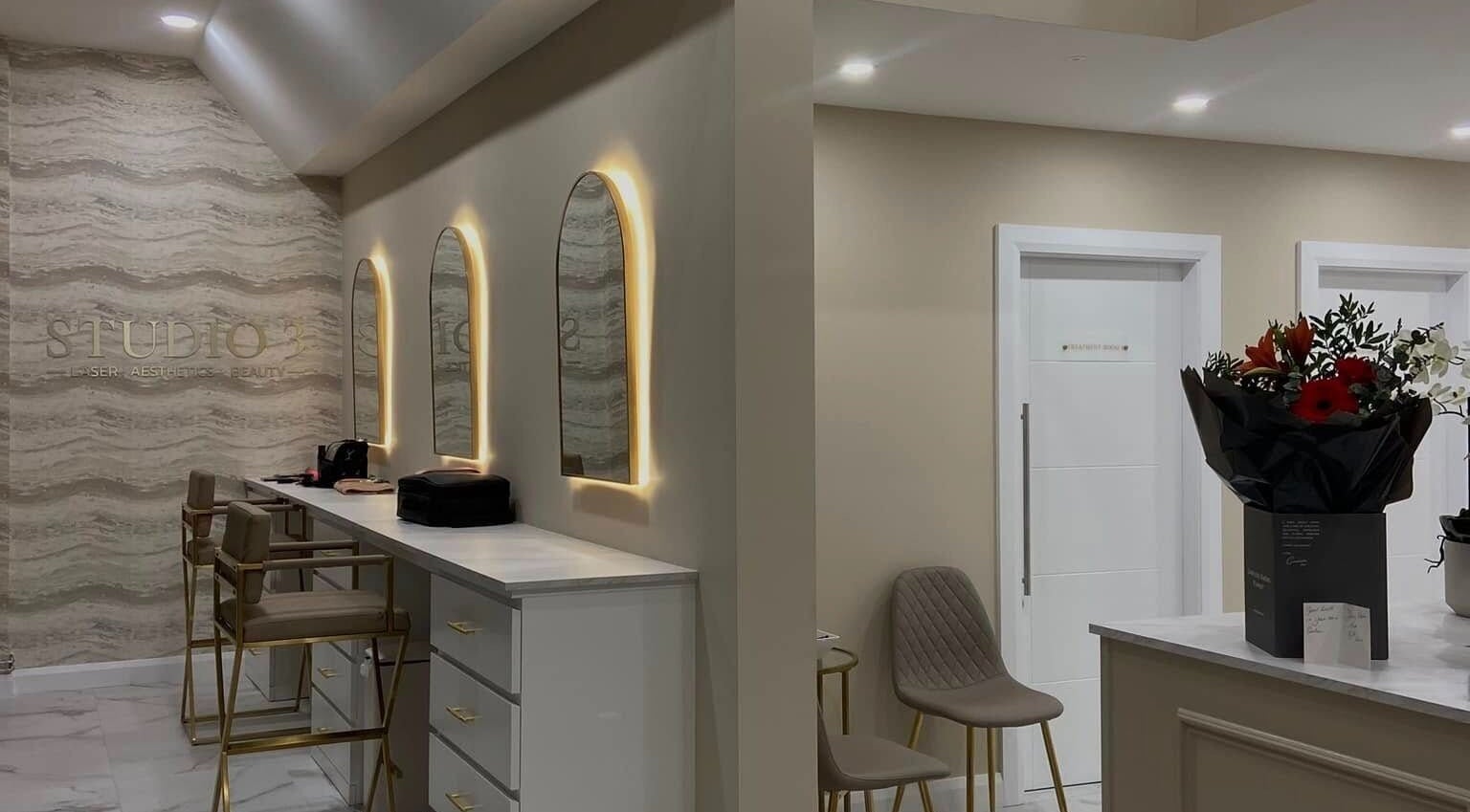 Elegant interior of Studio 3, Swatragh, Northern Ireland, GB with stylish mirrors and chic seating area.