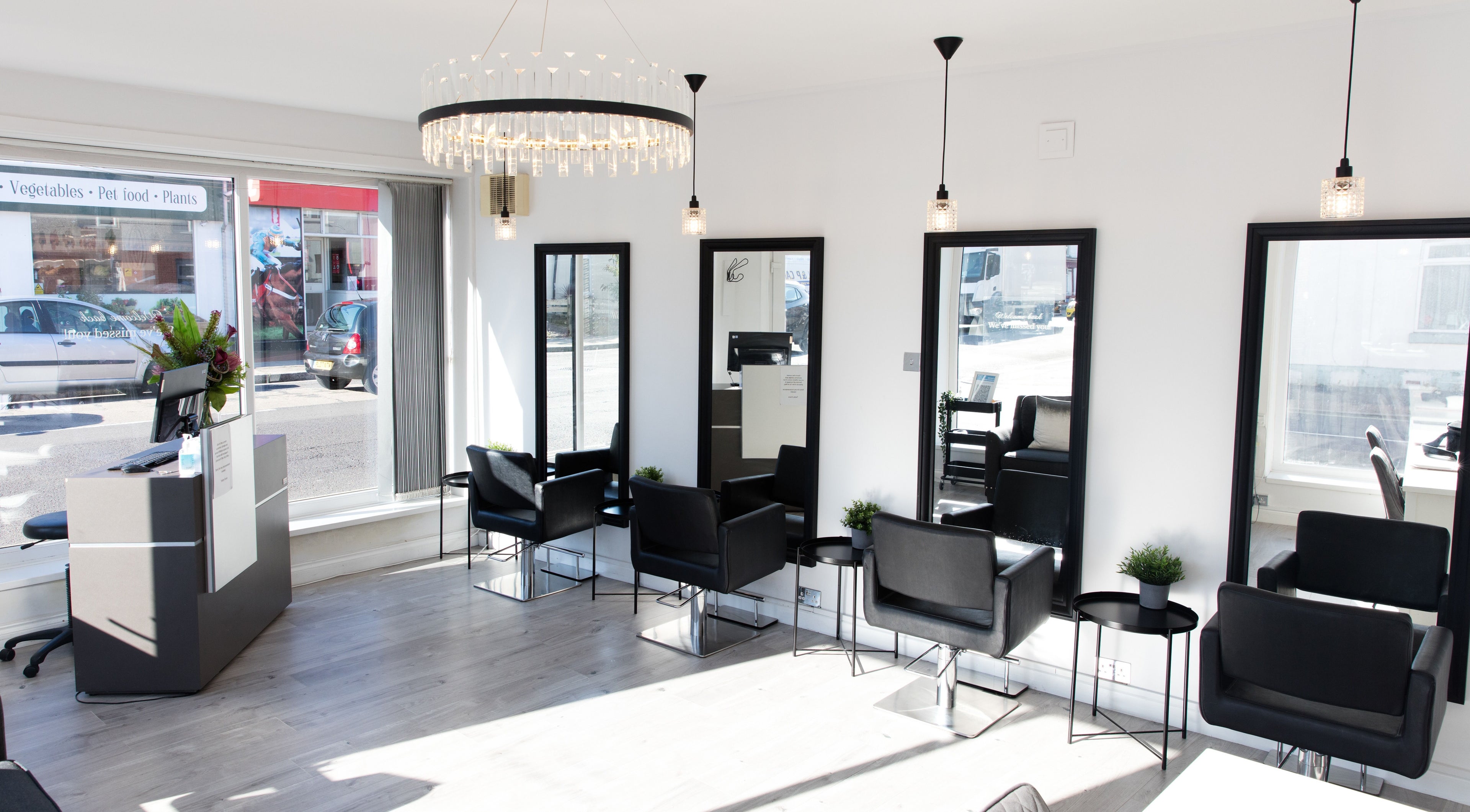 Modern salon chairs and mirrors at Teddy Grace Hair and Beauty, Gosport, England, GB, with natural light.