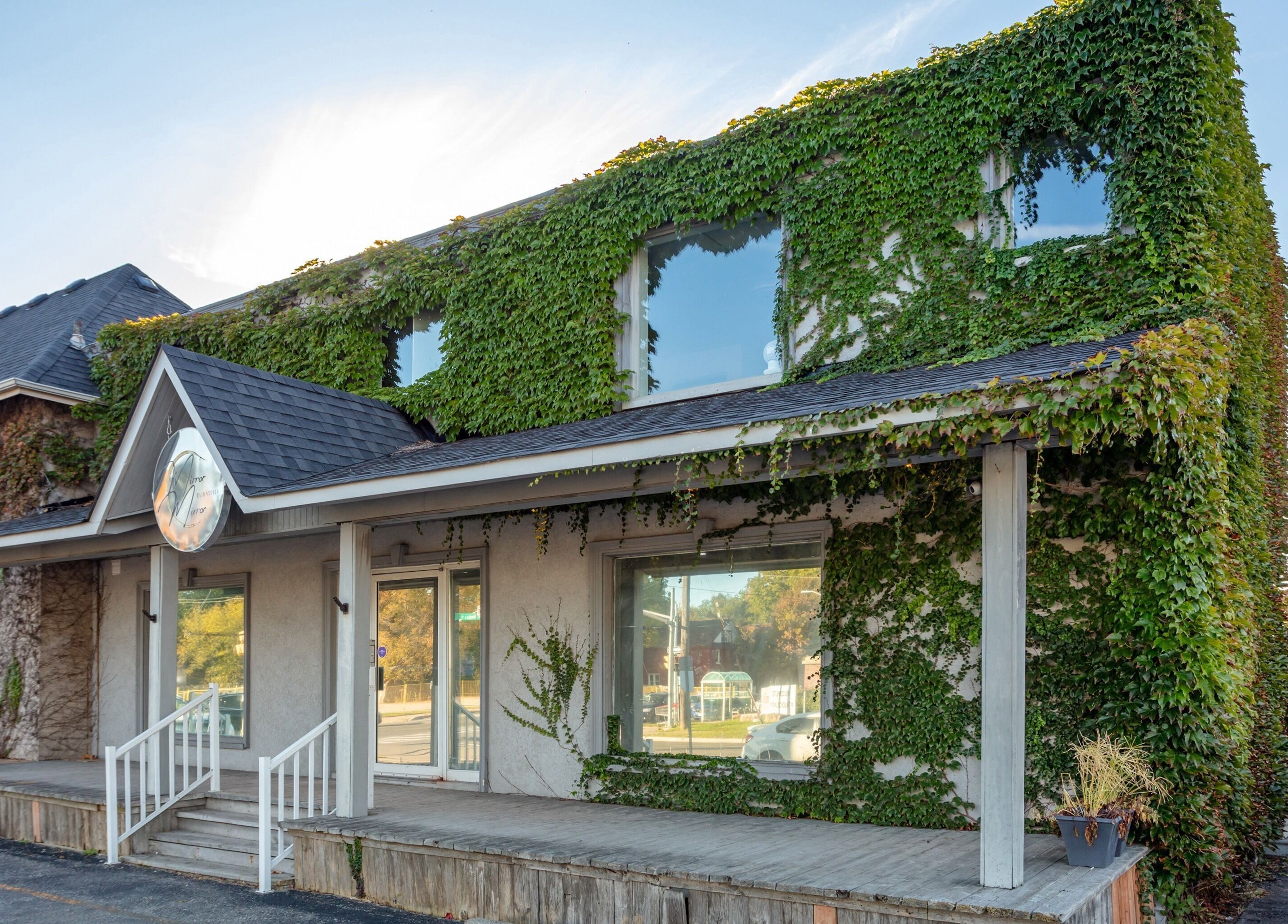 Mirror Mirror Hair Studio's lush ivy exterior in Oshawa, Ontario, CA. Please do not click new client to salon.