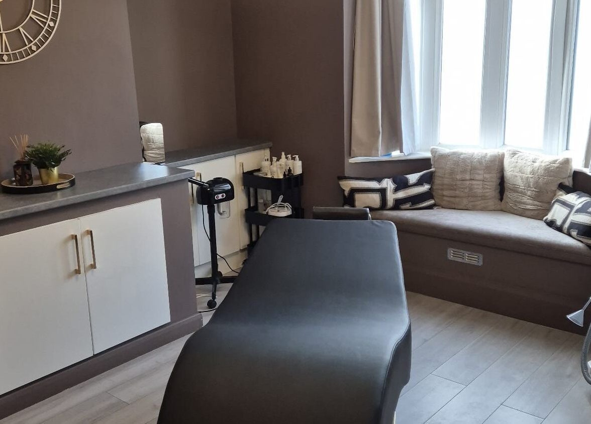 Treatment room interior at Skin Deep Beauty Room, Scunthorpe, England, GB, featuring a massage bed and cozy decor.