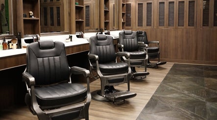 Modern barber chairs at The Barber Bar, Daerah Khusus Ibukota Jakarta, inviting for stylish grooming.