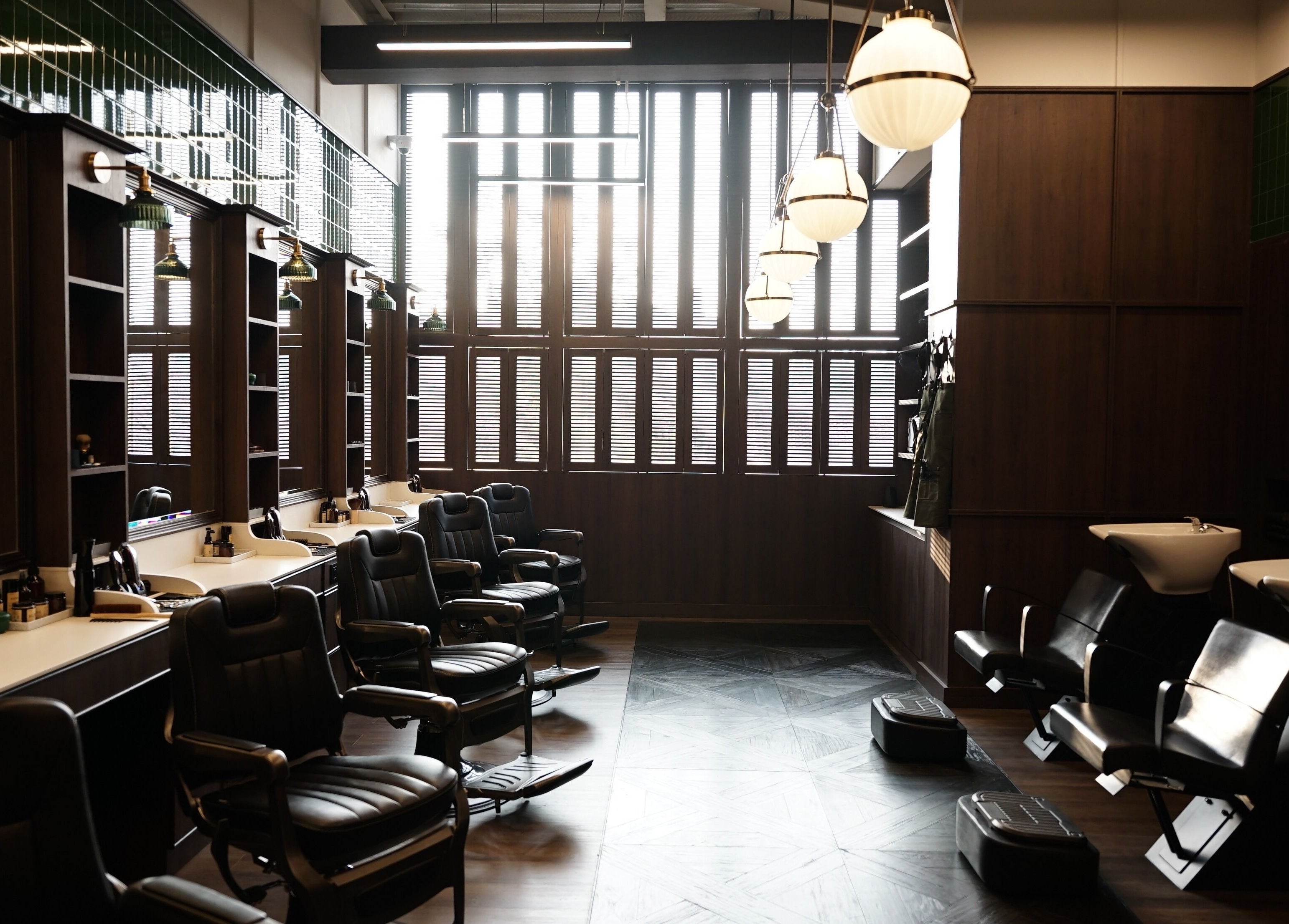 Elegant barber chairs at The Barber Bar, Daerah Khusus Ibukota Jakarta. Modern decor with classic flair.
