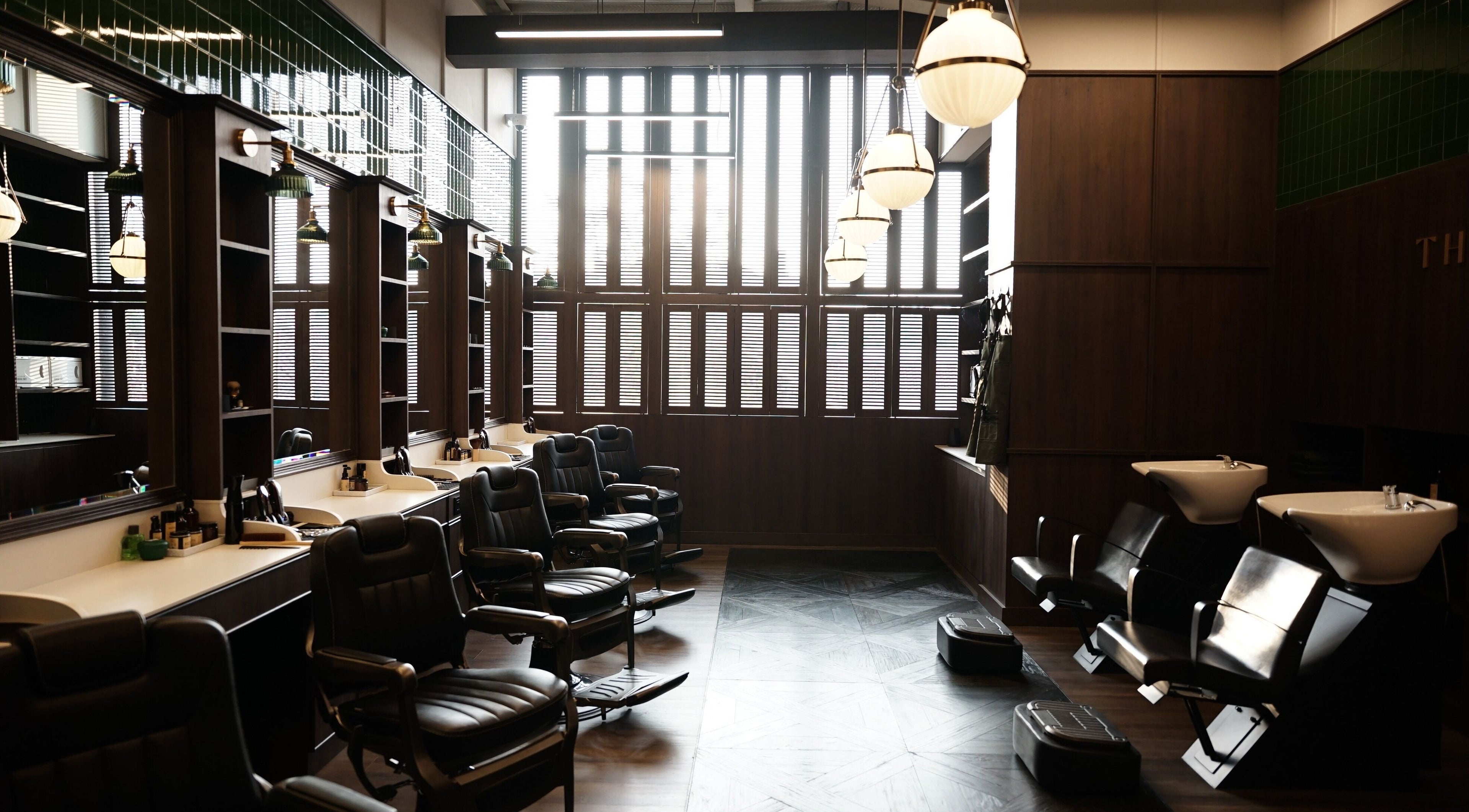 Elegant barber chairs at The Barber Bar, Daerah Khusus Ibukota Jakarta. Modern decor with classic flair.
