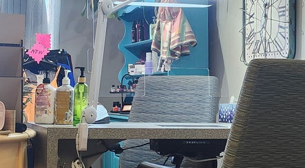 View of a stylish manicure station at Total Esthetics in Spruce Grove, Alberta, CA showcasing salon products.