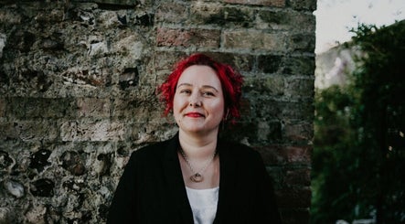 Relaxed individual in a garden at MASSAGE BY ZOË, Corby, England, GB.