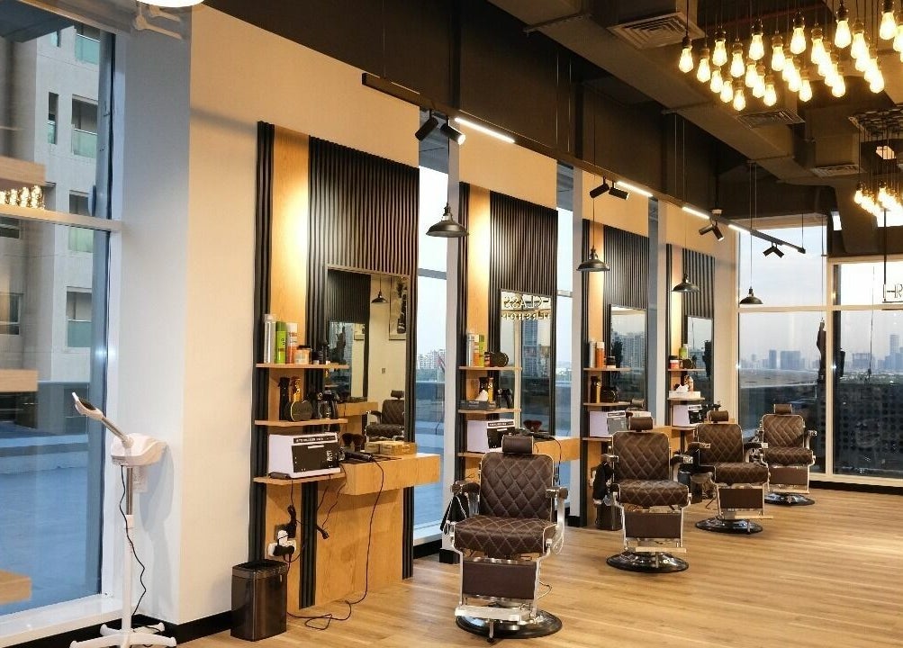 Chic interior of FreddyClassics Barbershop, Dubai, Dubai, AE, with luxury leather chairs and modern decor.