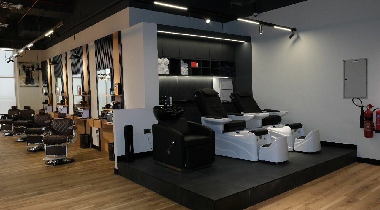 Chic interior of FreddyClassics Barbershop in Dubai, Dubai, AE, with modern styling chairs and sleek décor.