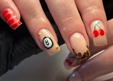 Intricate nail art at Salon 31 by Rosie, Heath And Reach, England, GB, featuring vibrant cherry and leopard designs.