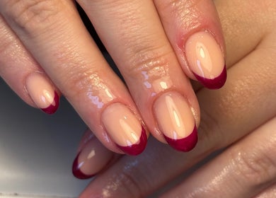 Elegant French manicure with deep red tips at Salon 31 by Rosie, Heath And Reach, England, GB.