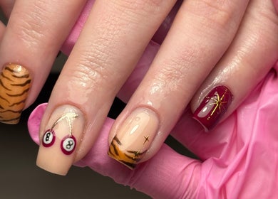 Elegant nail art design at Salon 31 by Rosie, Heath And Reach, England, GB showcasing various artistic styles.