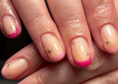 Elegant nail art at Salon 31 by Rosie, Heath And Reach, England, GB with pink tips and gold accents.
