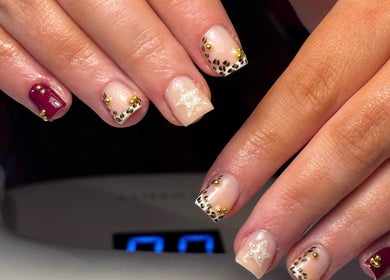 Stunning nail art with gold accents at Salon 31 by Rosie, Heath And Reach, England, GB.