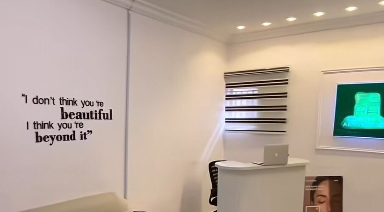 Stylish reception at Fora beauty and aesthetics, Lagos ajah, NG with motivational wall art.