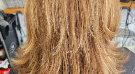 Beautiful layered hairstyle at Hair By Tory, Stowmarket, England, GB showcasing golden blonde highlights.