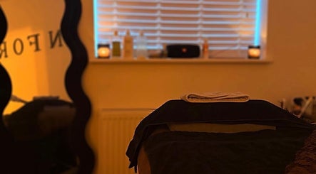 SKNFORM beauty room with massage table and candles in Newton-le-Willows, England, GB.