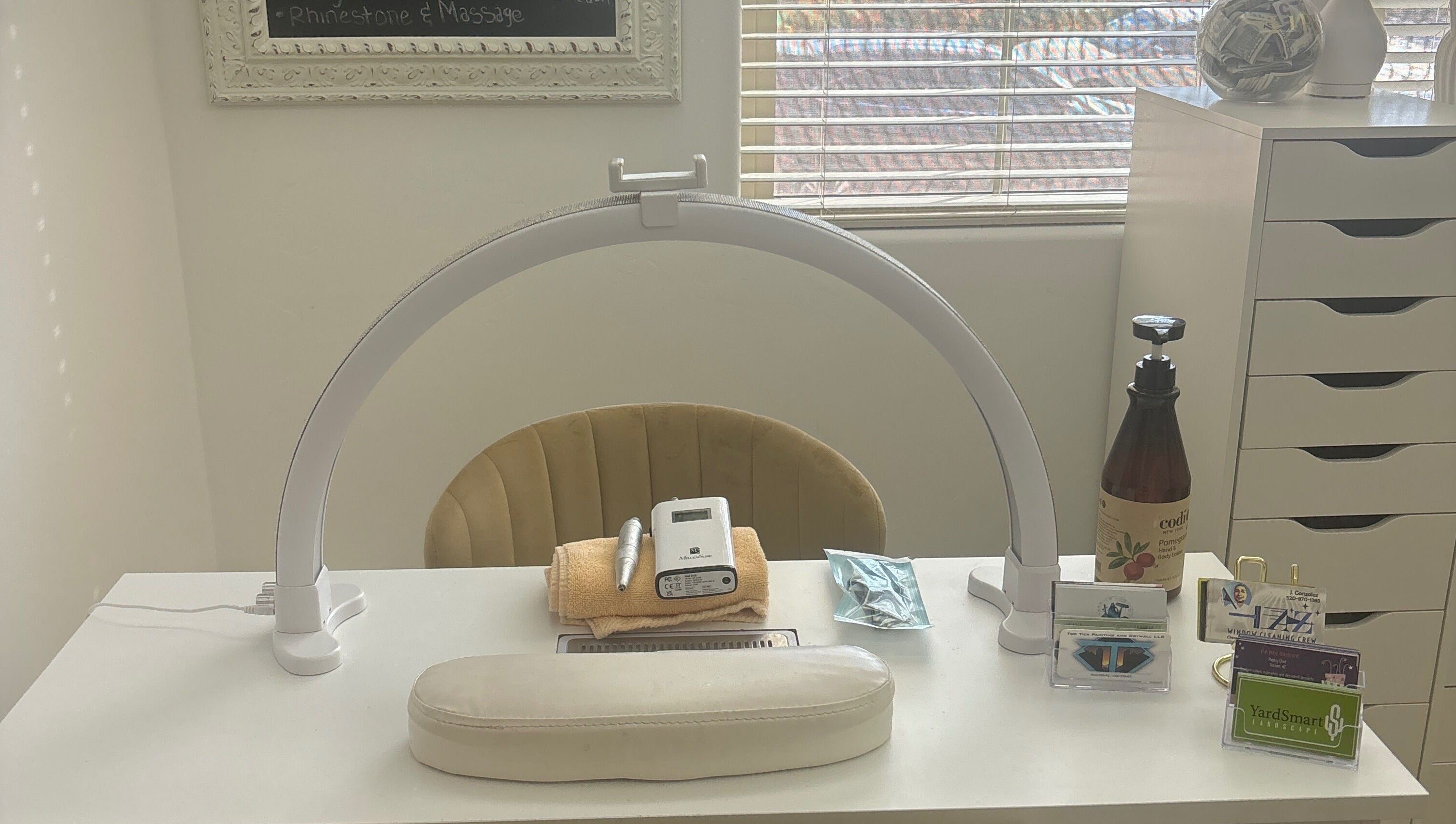 Nail station at House of Pedi’s by Lydia in Tucson, Arizona, US, featuring tools and soft lighting.