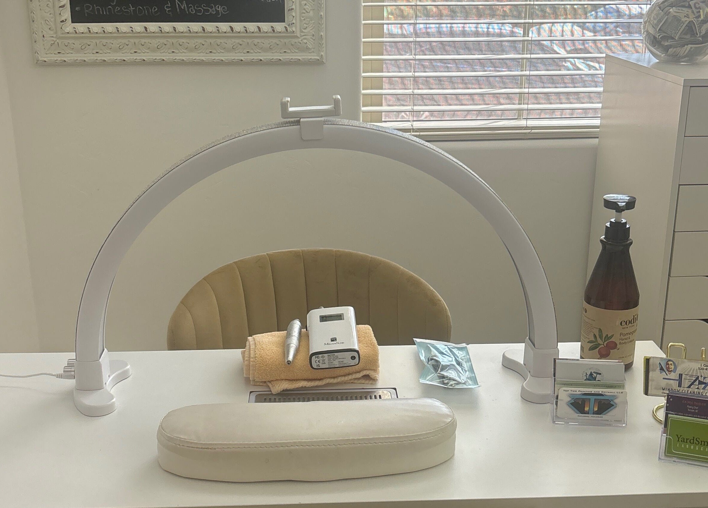 Nail station at House of Pedi’s by Lydia in Tucson, Arizona, US, featuring tools and soft lighting.