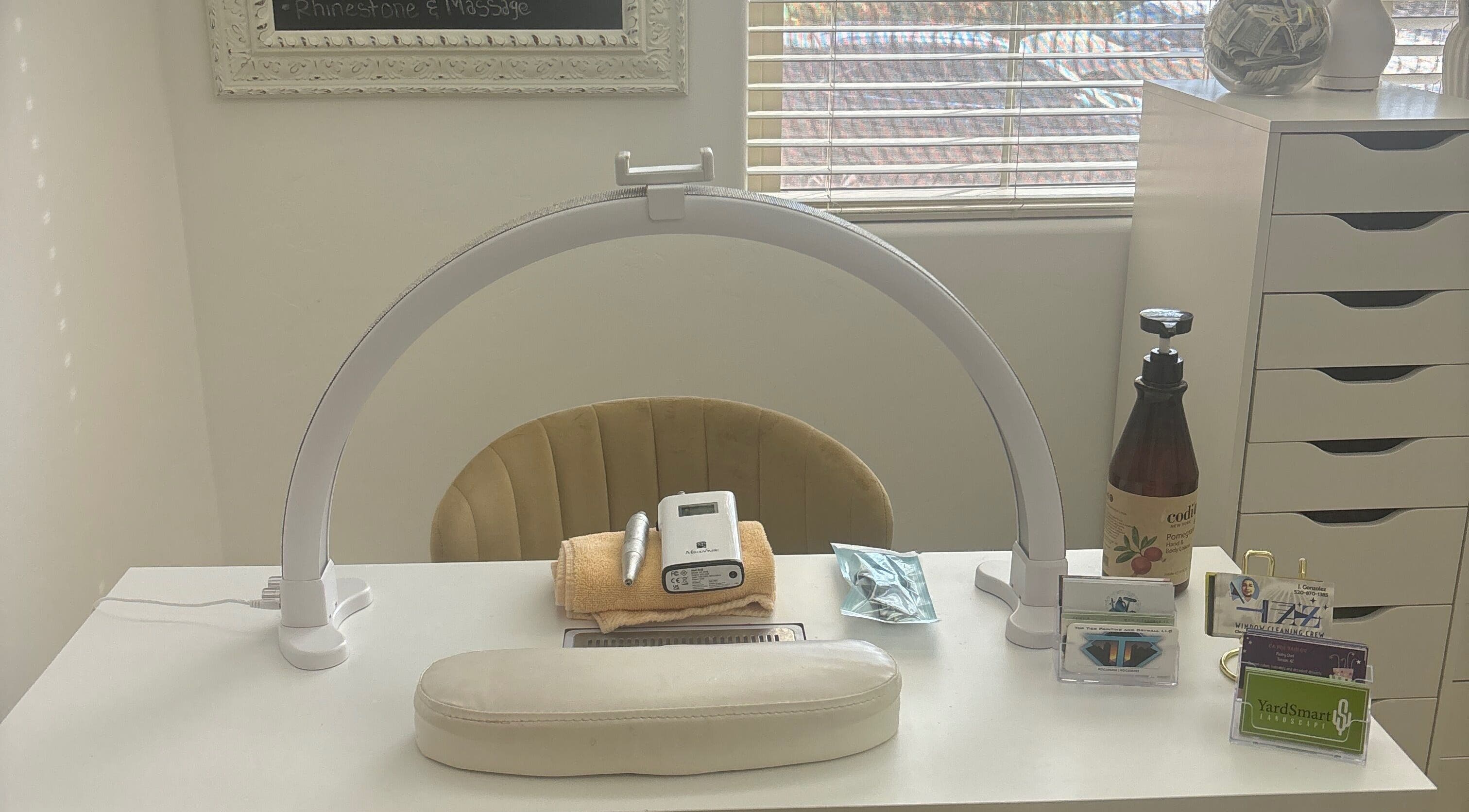 Nail station at House of Pedi’s by Lydia in Tucson, Arizona, US, featuring tools and soft lighting.