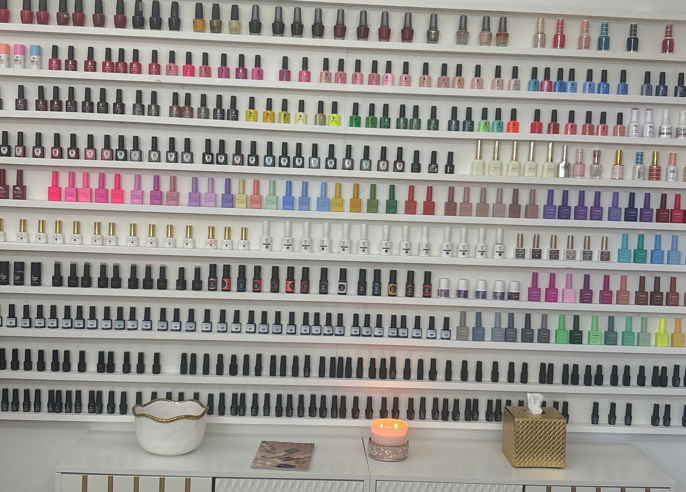 Colorful nail polish display at House of Pedi’s by Lydia in Tucson, Arizona, US, showcasing extensive selection.