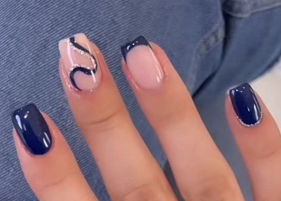 Elegant nail art at House of Pedi's by Lydia, Tucson, Arizona, US. Features modern dark blue designs.