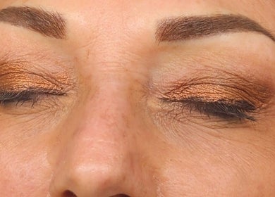 Close-up of shimmering eyelids with professional makeup at Remedi Permanent Makeup Corydon in Corydon, Indiana, US.