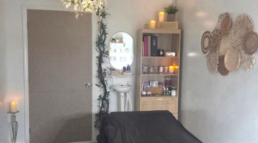 Cozy treatment room at Remedi Permanent Makeup Corydon in Corydon, Indiana, US with warm decor.