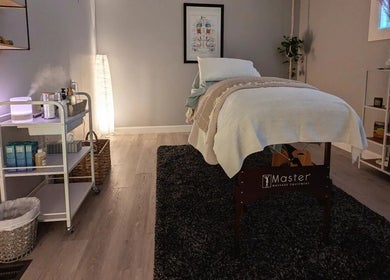 Peaceful massage room at The Celestial Root, Belleville, Ontario, CA featuring a neatly arranged treatment table.