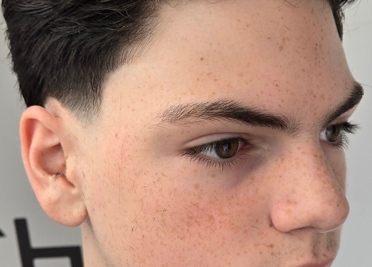 Close-up of a sleek men's fade haircut at Barber Stylist Ben, Windsor, Ontario, CA.