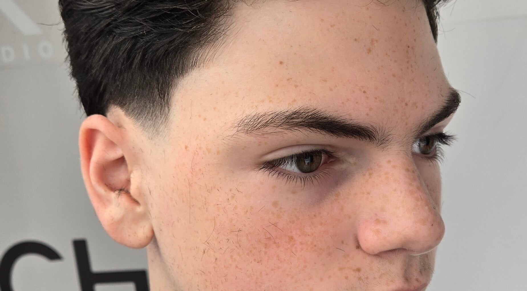 Close-up of a sleek men's fade haircut at Barber Stylist Ben, Windsor, Ontario, CA.