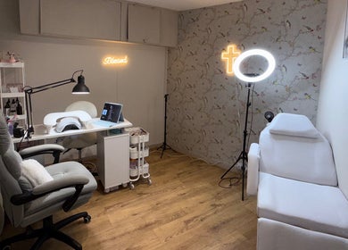 Mai Nails and Lash Studio in London, England, GB. Inviting seating with nail and lash equipment.