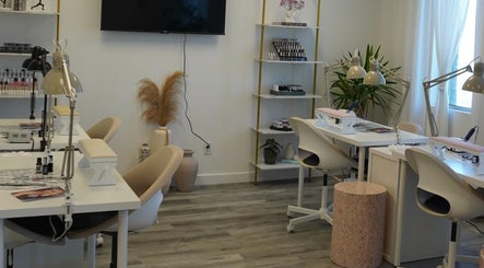 Chic nail salon interior at Shahz Nailz & Foot Clinique, Pointe-Claire, Québec, CA with modern decor and workstations.