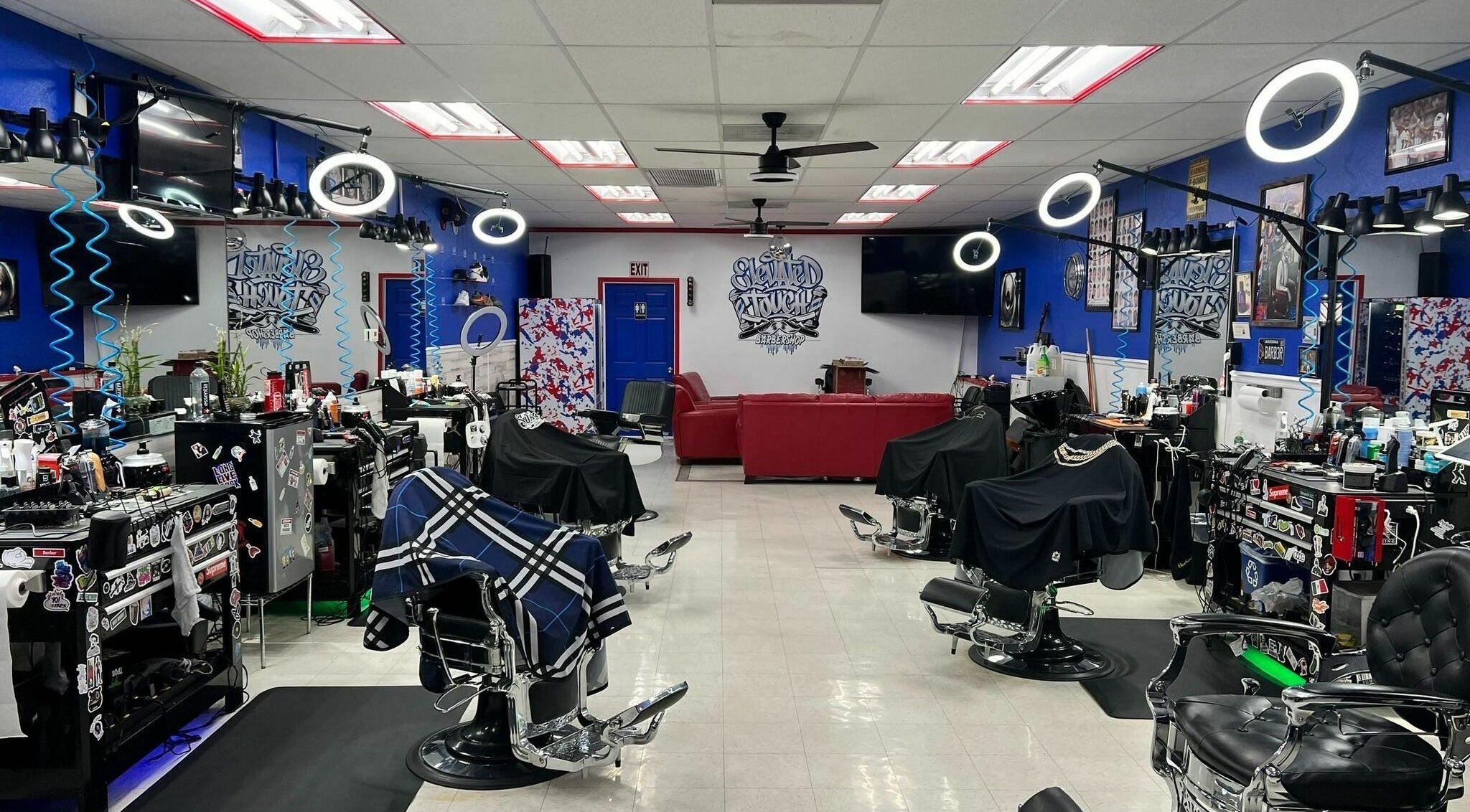 Interior of Elevated Touch Barbershop in Cottonwood, Arizona, featuring modern barber chairs and vibrant decor.