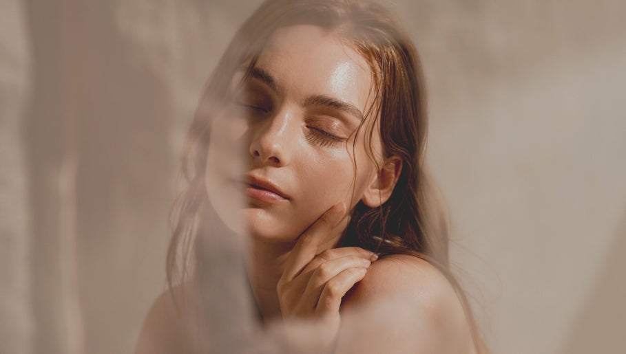 Relaxed woman with glowing skin at En Beauty -Lash and Japanese Face Lift- in Auckland, Auckland, NZ.