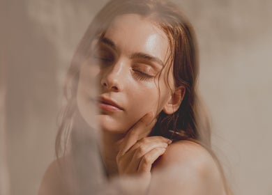 Relaxed woman with glowing skin at En Beauty -Lash and Japanese Face Lift- in Auckland, Auckland, NZ.