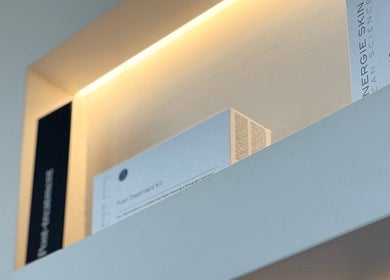 Skincare products on illuminated shelf at Skulptured Skin & Body, Ropes Crossing, New South Wales, AU.