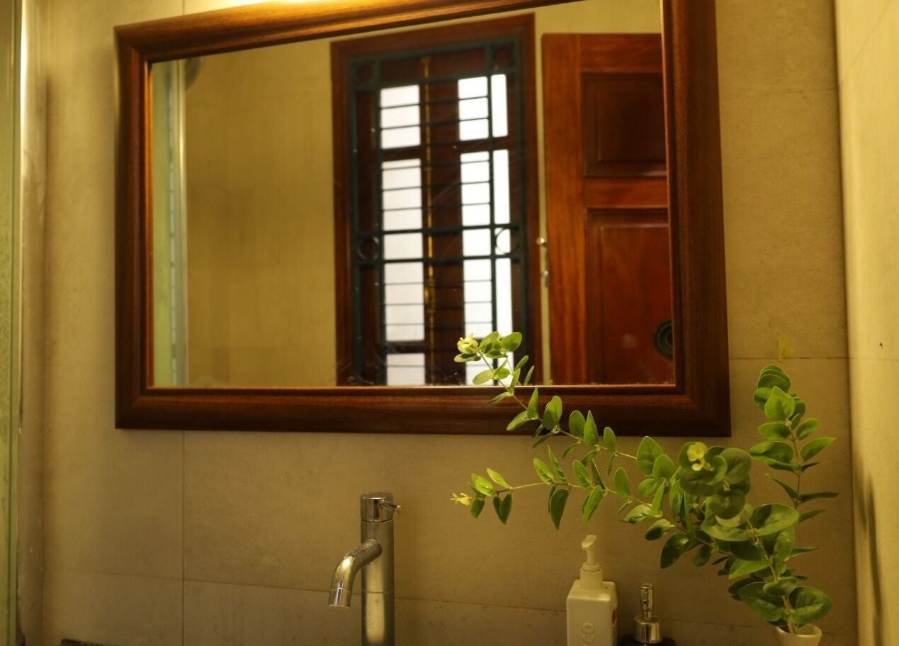Calming bathroom mirror with greenery at Midori Spa Hanoi in Hà Nội, Hà Nội, VN adds a tranquil touch.