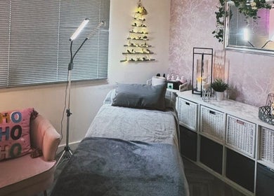 Cozy treatment room at Beauty With Katie in Dunfermline, Scotland, GB with modern decor and soft lighting.