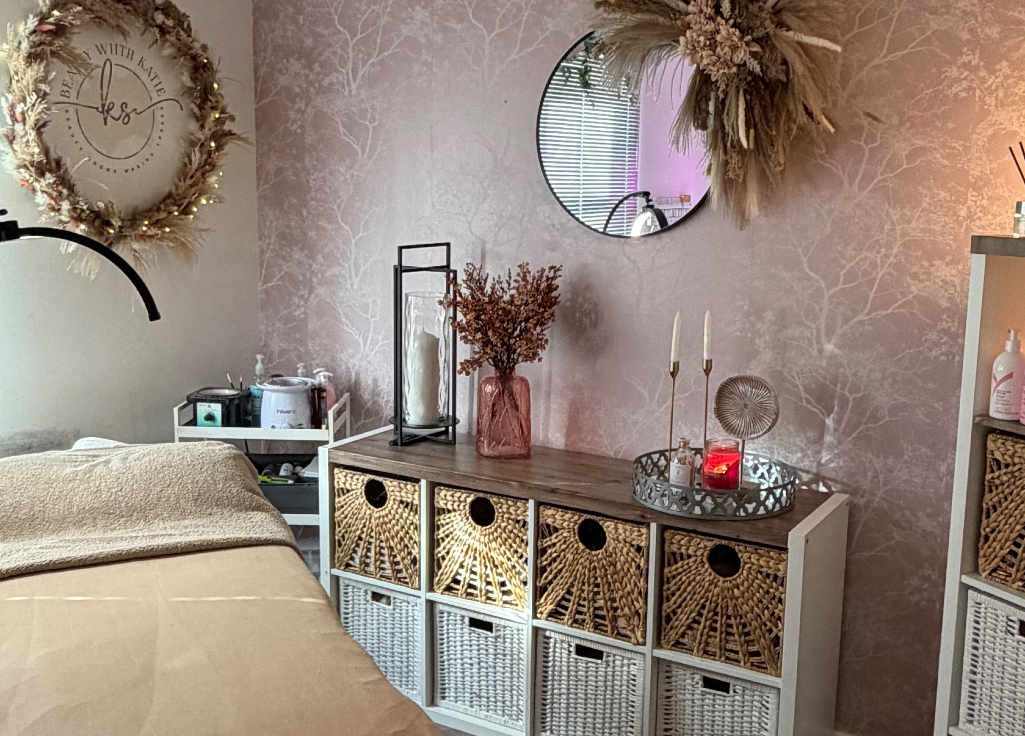 Tranquil treatment room at Beauty With Katie, Rosyth, Scotland, GB featuring elegant decor and warm lighting.